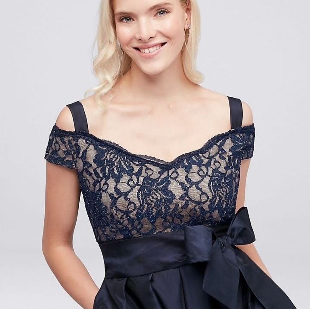 Rich Navy blue floor length off the shoulder gown.